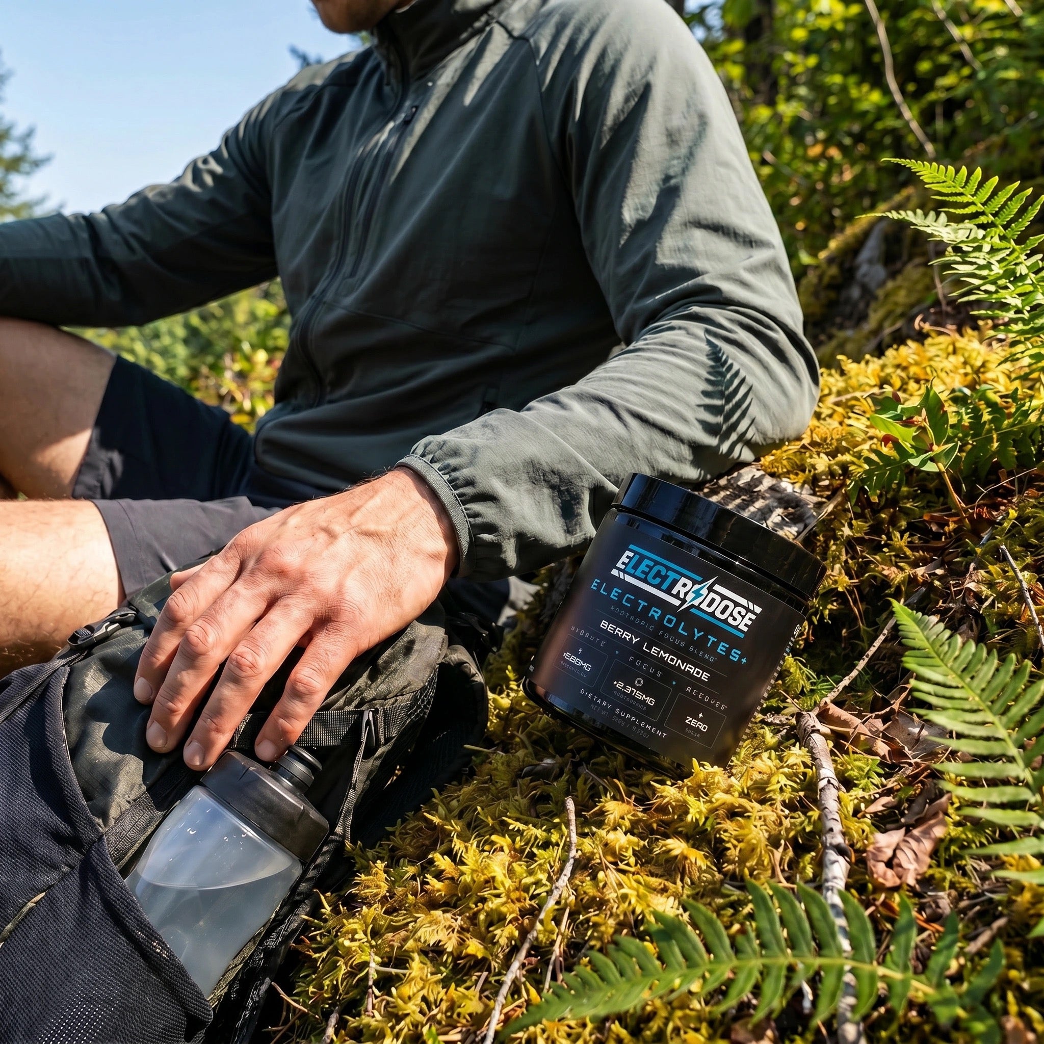 Electrodose Berry Lemonade tub on a mossy forest trail during a hike